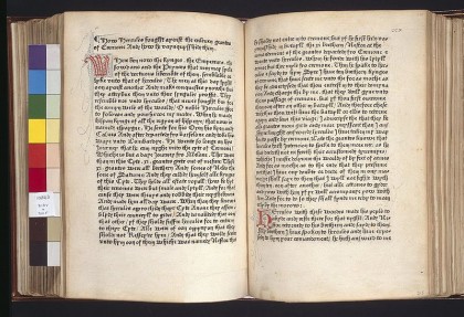 Open pages of an early printed book in gothic type, with a red decorated initial
